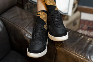 Person wearing our Sonder Triple Black Vegetable Tanned Leather Sneakers - Front view | Wayz Sneakers