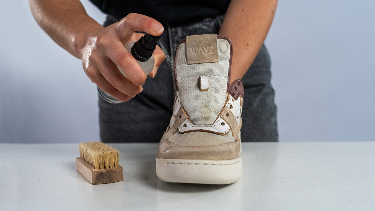 spraying the sonder white grey dry rose with a cleaning solution