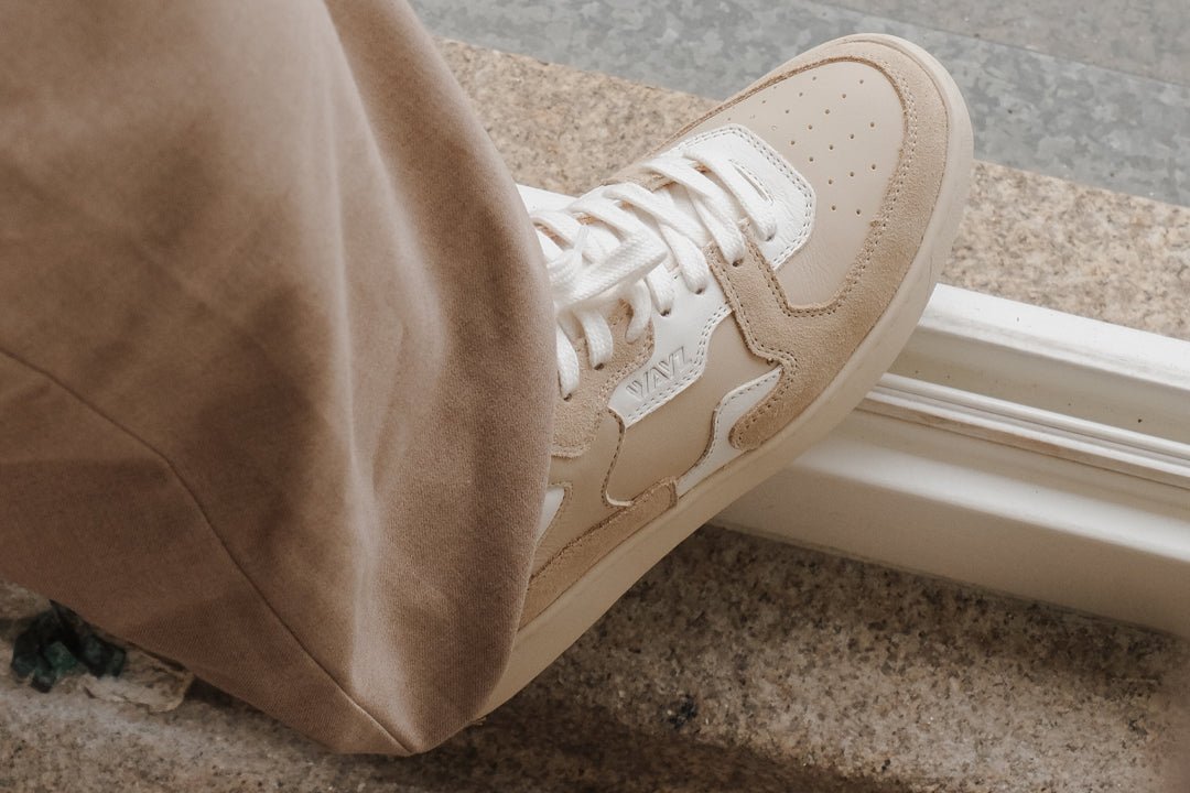 Wayz Sonder White Almond Milk sneaker on top of a step facing backwards