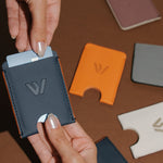 Wayz Card Holder blue jeans wallet with cards being pulled off and other models on the background