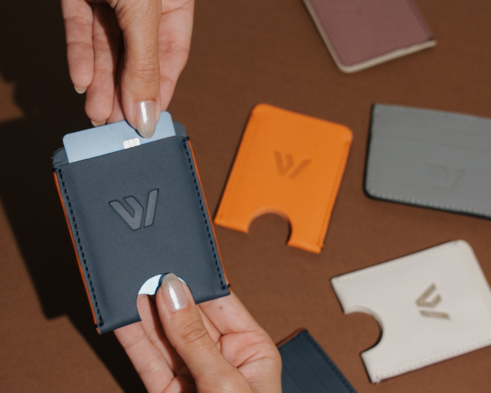 Wayz Card Holder blue jeans wallet with cards being pulled off and other models on the background