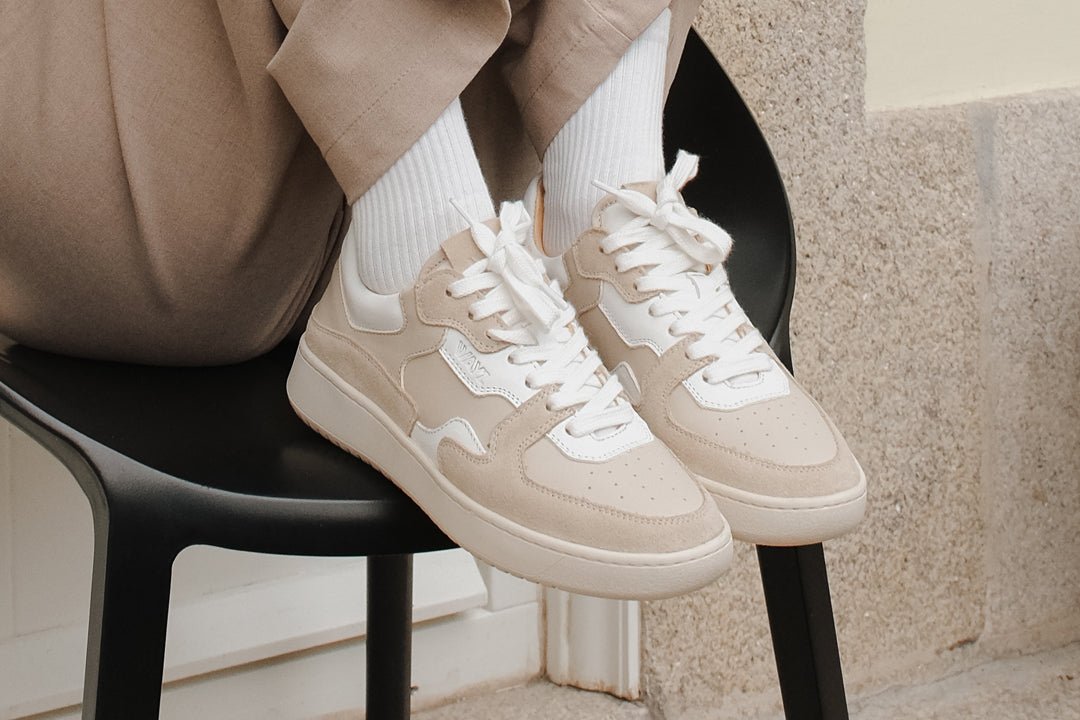 Wayz Sonder White Almond Milk sneakers on top of a chair 