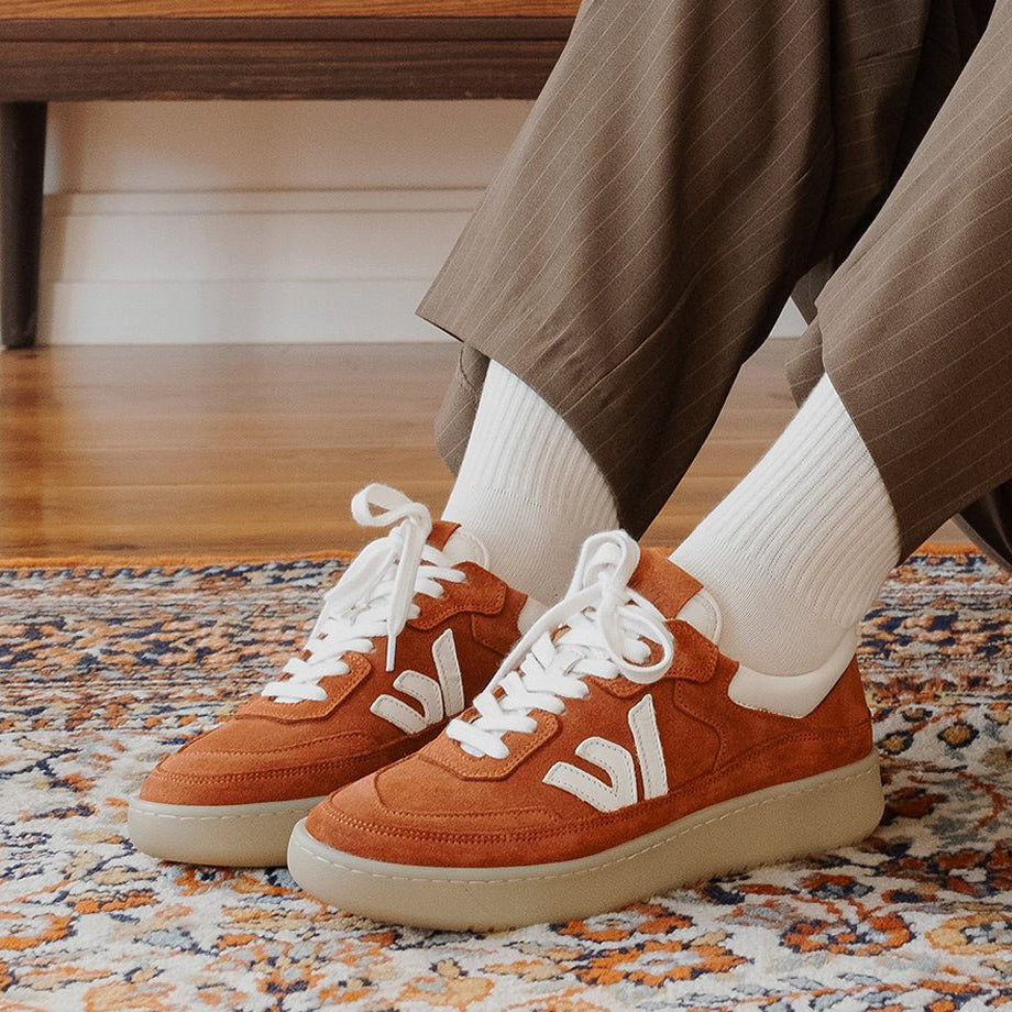 WAYZ Misfit Terracotta sneakers pairs on carpet.