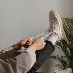 WAYZ Misfit White Gum sneakers being laced.