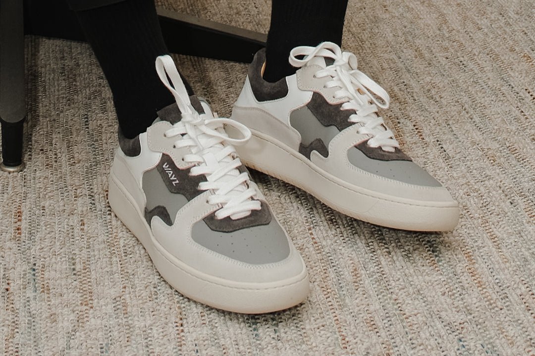 Wayz Sonder Triple Grey sneakers pairs stepping on carpet
