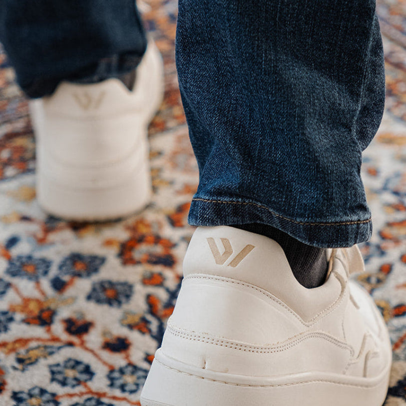 WAYZ Sonder White Grey Almond Milk sneakers turned back on carpet.