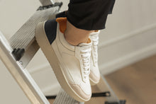 Load image into Gallery viewer,  Person wearing our Hedonist Mandarina Black Vegetable Tanned Leather Sneakers - Side view