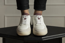Load image into Gallery viewer, Person wearing our Hedonist Dry Rose Vegetable Tanned Leather Sneakers - Front view