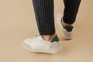 Person wearing our Hedonist White Grey Green Vegetable Tanned Leather Sneakers - Back view
