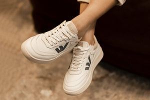 Person wearing our White Grey Almond Milk  Veg-Tan Leather Misfit Sneakers - Front View | Wayz Sneakers