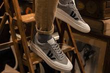 Load image into Gallery viewer, Person wearing our Misfit Ash Veg Tan Leather Sneakers - Side view