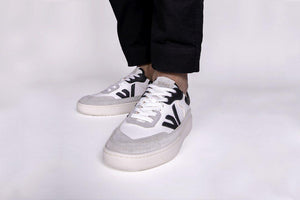Person wearing our White Grey Black Vegetable Tanned Leather Misfit Sneakers - Front View