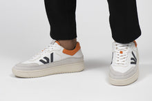 Load image into Gallery viewer, Person wearing our White Grey Orange Misfit Shoes - Front View | Wayz Sneakers