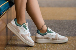 Person wearing our Sonder White Green Almond Milk Vegetable Tanned Leather Sneakers - Side view | Wayz Sneakers