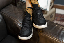 Load image into Gallery viewer, Person wearing our Sonder Triple Black Vegetable Tanned Leather Sneakers - Front view | Wayz Sneakers