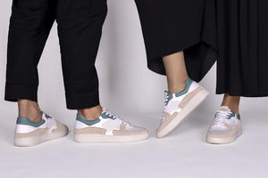 People wearing our Sonder White Green Almond Milk Vegetable Tanned Leather Sneakers - Side view | Wayz Sneakers