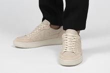 Load image into Gallery viewer, Person wearing Wanderer Almond Milk Veg-tan Leather Sneakers - Front view | Wayz Sneakers
