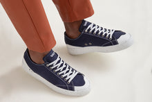 Load image into Gallery viewer, Person wearing The Grit Blue Vegan Sneakers - Side view | Wayz Sneakers