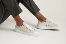 Load image into Gallery viewer, Person wearing The Grit Vegan Sneakers Cream - Side view | Wayz Sneakers